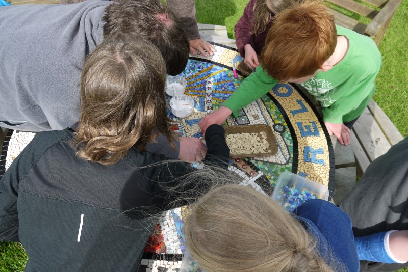 Children working on a mosaic